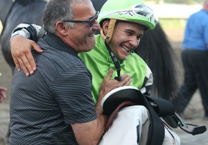 Trainer Marcus Vitali (L) and Jockey Nik Juarez celebrate in the Winners Circle at Monmouth Park in Oceanport, New Jersey on Sunday August 30, 2015, after Juarez guided the Vitali trained Valid to victory in the $150,000 Philip H. Iselin Stakes. Photo By Bill Denver/EQUI-PHOTO