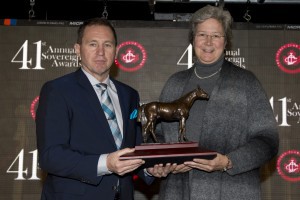 Debbie Easter, Executive Director of the VTA, accepts the Sovereign Award on behalf of Diane Manning at Saturday's dinner at Woodbine. Photo by Michael Burns.