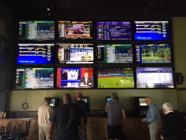A giant video wall at Breakers displays signals from 10 different tracks around the country in the afternoon and another 10 in the evening.
